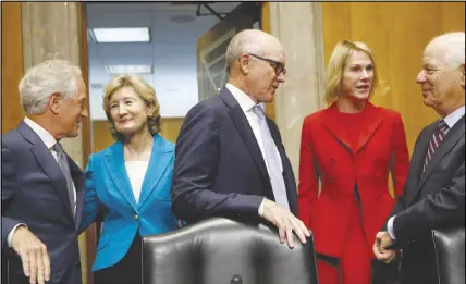  ?? AP PHOTO ?? From left, Sen. Bob Corker, R-Tenn., speaks with Kay Bailey Hutchison, who is nominated to be U.S. Permanent Representa­tive on the NATO Council, while Woody Johnson, owner of the New York Jets, who is nominated to be Ambassador to the United Kingdom,...