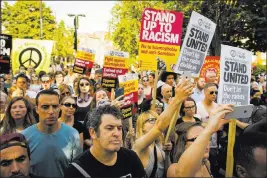  ?? Dominic Lipinski ?? The Associated Press A vigil was held Tuesday in Finsbury Park near where a driver plowed into a crowd spilling out of a north London mosque after Ramadan services.