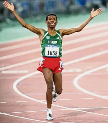  ?? — AFP ?? Strong stand: Former long distance running great Haile Gebrselass­ie and now president of the Ethiopia Athletics Federation wants drug cheats in his country to be banned for life instead of the IOC’s four-year suspension.