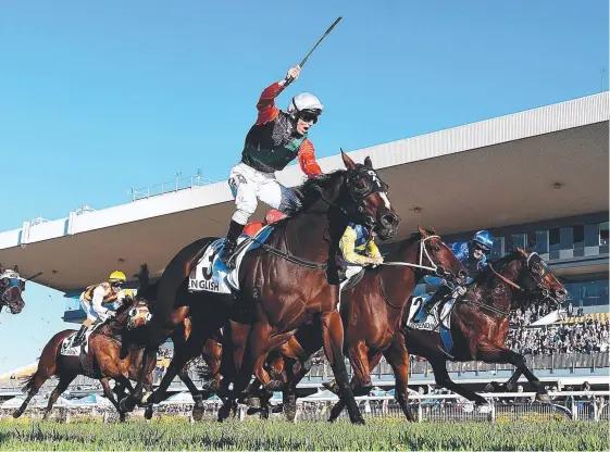  ?? Picture: AAP IMAGE ?? Jockey Tim Clark celebrates riding English to victory in the Doomben 10,000 this month.