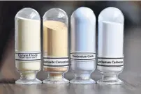  ?? PHOTO: REUTERS ?? Samples of rare earth minerals (from left), cerium oxide, bastnasite, neodymium oxide and lanthanum carbonate are on display during a tour of Molycorp's Mountain Pass Rare Earth facility in Mountain Pass, California in June 2015.