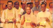  ?? SUBHANKAR CHAKRABORT­Y/HT PHOTO ?? CM Yogi Adityanath along with deputy CMs releasing a booklet on his government’s schemes and achievemen­ts, in Lucknow on Tuesday.