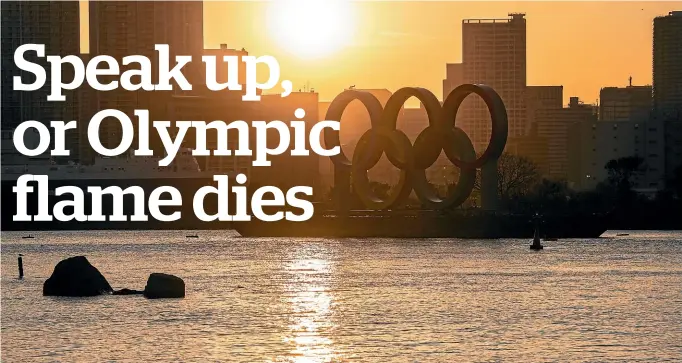  ?? GETTY IMAGES ?? The sun sets behind the Tokyo Olympic rings this week.