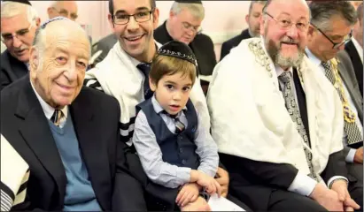  ?? PHOTO: MYDAS ?? Three generation­s of the Sturgess family — Raymond Sturgess, Rabbi Daniel Sturgess and his four-year-old son, Yeshaya — with Chief Rabbi Ephraim Mirvis at the St Albans Synagogue induction ceremony