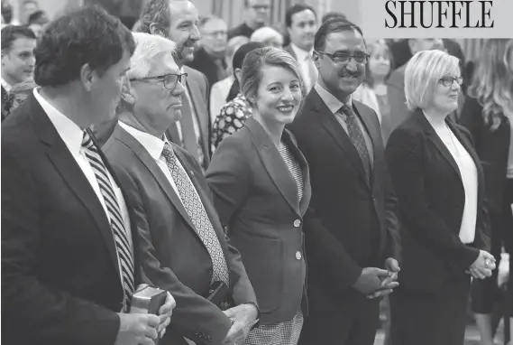  ?? PATRICK DOYLE/THE CANADIAN PRESS ?? Dominic LeBlanc, from left, Jim Carr, Mélanie Joly, Amarjeet Sohi and Carla Qualtrough attend a swearing-in ceremony at Rideau Hall in Ottawa on Wednesday.