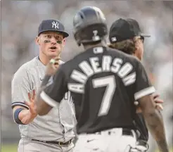  ?? Chris Sweda / TB ?? Yankees third baseman Josh Donaldson, left, and White Sox shortstop Tim Anderson have words in the first inning on May 13.