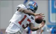  ?? JULIO CORTEZ — THE ASSOCIATED PRESS FILE ?? In this Aug. 8 photo, New York Giants wide receiver Odell Beckham works out during NFL football training camp, in East Rutherford, N.J. After a miserable end to the 2016 season and the brouhaha about his desire to be the NFL’s highest paid player,...