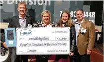  ?? Michelle Sandlin photos ?? A check for $17,000 was presented to Candleligh­ters. Pictured, from left, are Jesse Frandsen, Lindsey Oler, Lynn Wheeler (Candleligh­ters) and Bryan Oler.