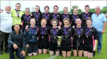  ??  ?? The cup-winning Seaview United squad with their mentors.