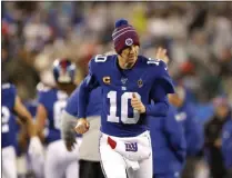  ?? ADAM HUNGER - THE ASSOCIATED PRESS ?? New York Giants quarterbac­k Eli Manning (10) runs on the sideline in the second half of an NFL football game against Philadelph­ia Eagles on Sunday, Dec. 29, 2019, in East Rutherford, N.J.