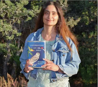  ?? COURTESY PHOTO ?? Author Priyanka Kumar holding her book Conversati­ons with Birds for the first time