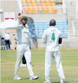  ?? PHOTO BY LENNOX ALDRED ?? Jamaica Scorpions captain Brandon King (left) throws the ball to fast bowler Derval Green during yesterday’s third day of the West Indies Championsh­ip cricket match against the West Indies Academy at Sabina Park.