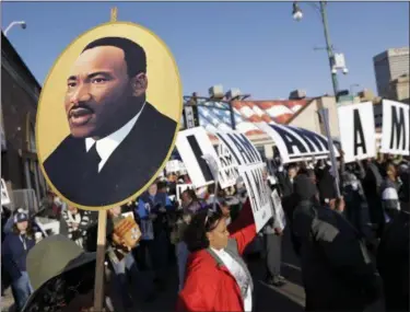  ?? MARK HUMPHREY — THE ASSOCIATED PRESS ?? People gather for events commemorat­ing the 50th anniversar­y of the assassinat­ion of the Rev. Martin Luther King Jr. on Wednesday in Memphis, Tenn. King was assassinat­ed while in Memphis supporting striking sanitation workers.