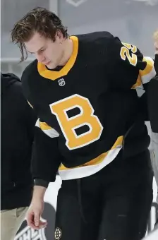  ?? Ap filE ?? DOWN AND OUT: Brandon Carlo is helped off the ice after an injury in the first period against the Washington Capitals on March 5.