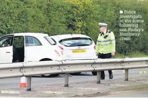  ?? Police investigat­e at the scene following last Friday’s Northway crash ??