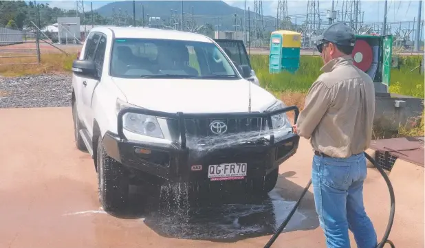  ??  ?? COMING CLEAN: Powerlink is helping protect Queensland’s banana industry from Panama disease by making a wash-down facility available to biosecurit­y field crews.