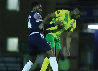  ?? ?? Emile Acquah (right) holds off Nathan Ferguson. Photo Credit: Whitby Boot/SUFC