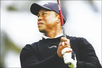  ?? RYAN KANG/AP ?? TIGER WOODS tees off on the second hole during the Genesis Invitation­al pro-am event at Riviera Country Club on Wednesday in the Pacific Palisades area of Los Angeles.