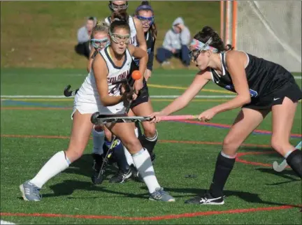  ?? GENE WALSH — DIGITAL FIRST MEDIA ?? Plymouth Whitemarsh’s Ava Borkowski works to knock down the ball as Central Bucks South’s Madelyn Cooper defends during their District 1-3A second round game Wednesday.