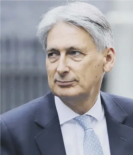  ??  ?? 0 Is Philip Hammond about to fulfil Theresa May’s pledge about the end of austerity in Britain or will he just put off fixing what has been broken by it?