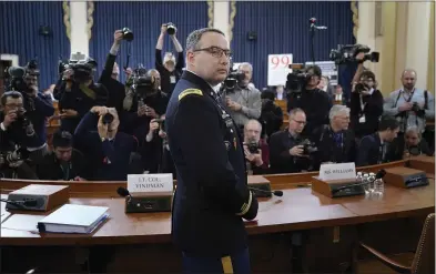  ?? WIN MCNAMEE — GETTY IMAGES ?? Lt. Col. Alexander Vindman, National Security Council director for European Affairs, arrives Tuesday to testify before the House Intelligen­ce Committee during a public impeachmen­t inquiry hearing into President Donald Trump’s actions in Washington, D.C.