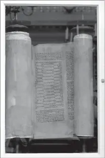  ??  ?? A 500-year-old Torah gifted to the Touro Synagogue, the nation’s oldest, is seen Thursday in its Ark in Newport, R.I.