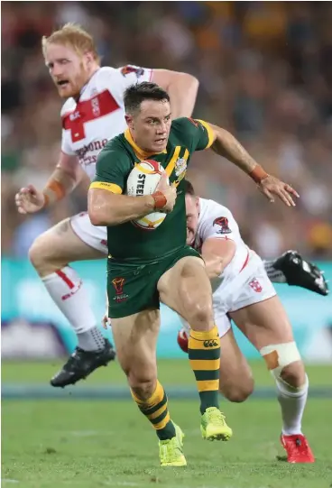  ??  ?? Photo: Zimbio Australian Kangaroo halfback Cooper Cronk on the attack against England at the Rugby League World Cup on December 2, 2017 in Brisbane, Australia. Australia won 6-0.