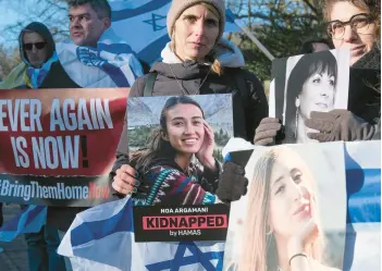  ?? PATRICK POST/AP ?? Pro-Israel activists gather Friday near the Internatio­nal Court of Justice in The Hague, Netherland­s.