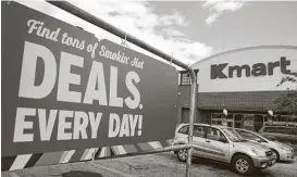  ?? Scott Olson / Getty Images ?? Customers shop at a Kmart in Elmhurst, Ill. Sears Holdings Corp,, Kmart’s owner, is working to transform the company’s business model.