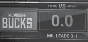  ?? KEVIN C. COX/POOL PHOTO ?? The game clock sits at 0.0 after the scheduled start time of Game 5 between the Bucks and Magic.