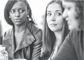  ?? MARTIN E. KLIMEK, USA TODAY ?? Google employees Jessica Moore, left, and Ashley Carrick work on the Diversity Core program.