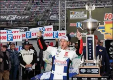  ?? (AP/Wade Payne) ?? Denny Hamlin celebrates Sunday after winning a NASCAR Cup Series race in Bristol, Tenn. Hamlin has become arguably the biggest villain in the sport, but the best bad guys win and Hamlin did that Sunday for the 21st time in the last six seasons.