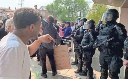  ??  ?? Unrest continued Monday in Kenosha, Wis., after a Black man was shot in the back by police. The governor deployed the National Guard to stem violence as questions about the shooting remained unanswered. ANGELA PETERSON/USA TODAY NETWORK