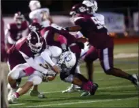  ?? TANIA BARRICKLO — DAILY FREEMAN ?? Kingston’s Devin Hines tackles Warwick’s Joe Miller in the first half of Tigers’ 14-10 loss to Wildcats.