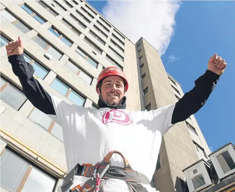  ??  ?? A CHARITY has scaled new heights at Dundee University Dental Hospital building.
Pamis — which helps people with profound and multiple learning disabiliti­es and their families — hosted an event which saw 20 daredevils take part in an abseil to raise...