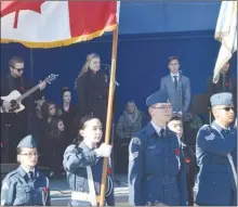  ?? MELANIE EKSAL/Penticton Herald ?? Grace Grant of Pen-Hi, centre stage, sings an original song titled “The Letter,” which was written by her older sister, Belle Grant. Grant and Grace Robinson of Princess Margaret arranged the Remembranc­e Day ceremony in Gyro Park on Thursday that saw well over 1,000 in attendance.