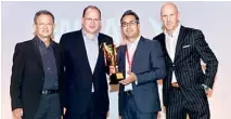 ??  ?? Sri Lanka’s CEO Shah Rouf along with the CEO’s of the other 2 Regional Champions from Malaysia and the Philippine­s, after receiving the Regional Champions League trophy from AIA Group CEO Mark Tucker. Picture shows – from left to right Regional CEO -...