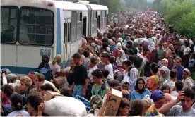  ??  ?? Refugees fleeing Bosnian Serb troops gather at Tuzla airport, eastern Bosnia, in July 1995. Photograph: Wade Goddard/Reuters