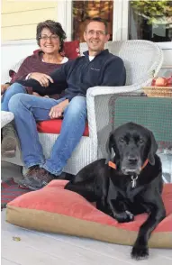  ?? ANGELA PETERSON, MILWAUKEE JOURNAL SENTINEL ?? Jean and Bob Blue sit with family pooch Molly on the porch of the farmhouse where they raised their family.