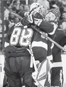  ?? ASSOCIATED PRESS FILE PHOTO ?? Nikita Kucherov hugs goalie Andrei Vasilevski­y (88) after the Lightning beat Washington, 3-2, in Game 5 of the Eastern Conference final in May.