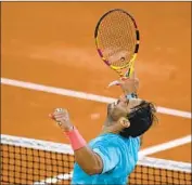  ?? Anne- Christine Poujoulat Getty I mages ?? RAFAEL NADAL exults after beating Jannik Sinner in the latest end to a match in French Open history.