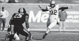  ?? HUNTER DYKE/GETTY ?? Vanderbilt’s Sarah Fuller kicks off to start the second half against Missouri on Saturday.