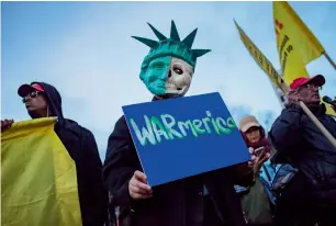  ?? AP ?? Protesters rally against the US missile strikes in New York. —