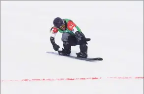  ?? Maddie Meyer / Getty Images ?? Lindsey Jacobellis of Team United States crosses the finish line to win the gold medal during the Snowboard Mixed Team Cross Small Final on Day 8 of the Beijing 2022 Winter Olympics at Genting Snow Park on Saturday in Zhang jiakou, China.