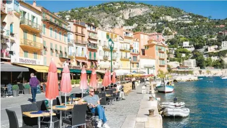  ?? CAMERON HEWITT/RICK STEVES’ EUROPE ?? Hilly Villefranc­he-sur-Mer on the French Riviera is a cascade of splashy colors.