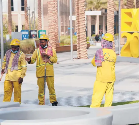  ?? JON GAMBRELL/AP ?? Cleaners seen in October at Expo 2020 in the United Arab Emirates.