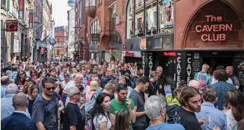  ??  ?? This is now: The excited crowd queuing up yesterday at the modern Cavern