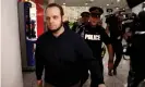  ??  ?? Joshua Boyle walks through the airport after arriving with his wife and three children in Toronto. Photograph: Mark Blinch/Reuters
