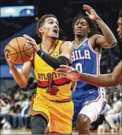  ?? JOHN BAZEMORE/AP ?? Trae Young and the Hawks will look to rebound after Friday’s home loss when they host a short-handed Hornets team today at 6 p.m. on BSSE.