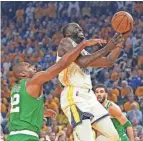  ?? TODAY SPORTS DARREN YAMASHITA/USA ?? Warriors forward Draymond Green goes to the basket against Celtics center Al Horford on Sunday in Game 2 of the NBA Finals.